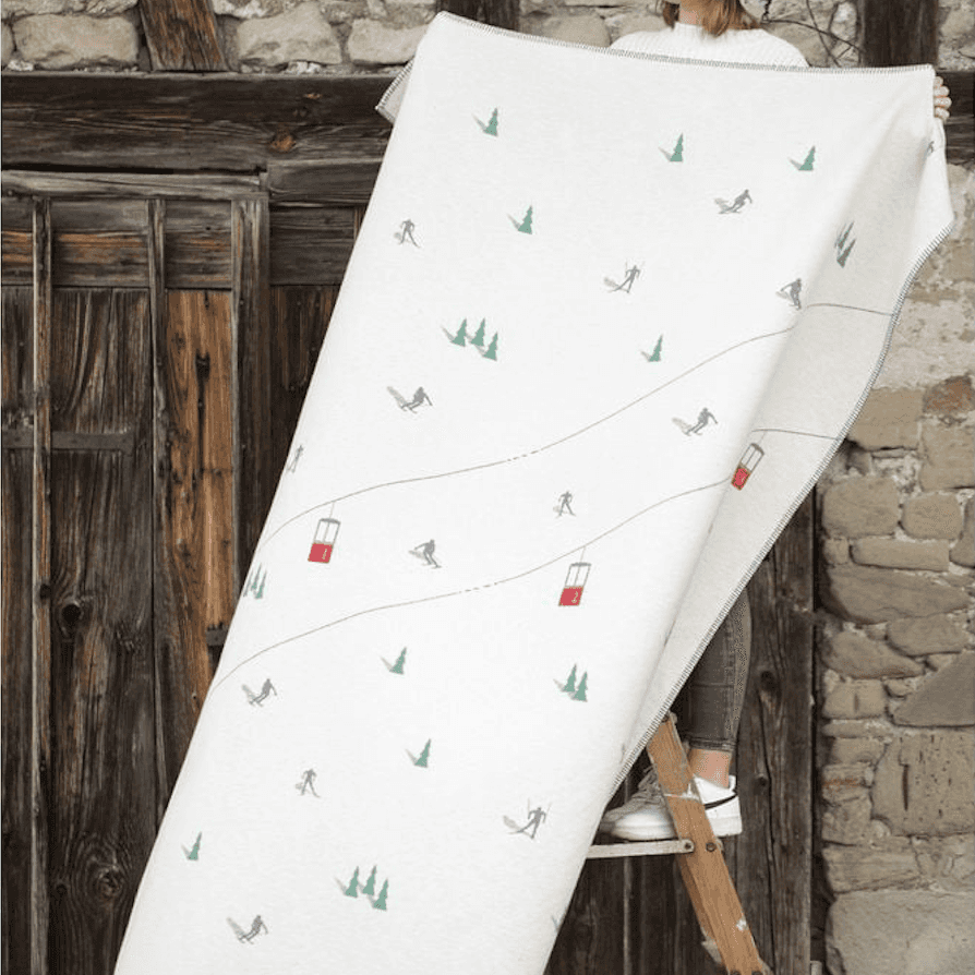 Immagine principale di Plaid invernale in Cotone Pista Scii e e Cabine 140x200 cm (2 Colori) | David Fussenegger